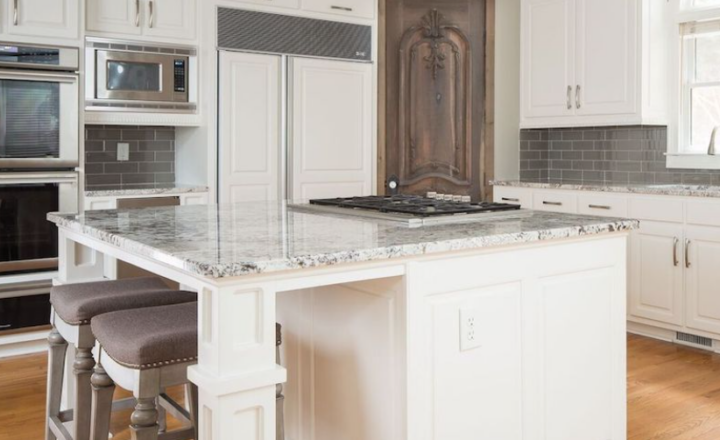 https://tcfmidwest.com/wp-content/uploads/2023/10/White-granite-countertops-in-Bianco-Antico-with-a-white-kitchen-island-for-a-remodel-in-Chicago-720x440.png